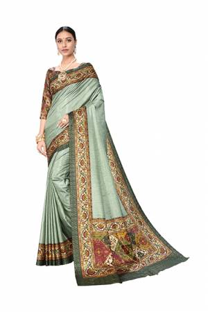 Add This Designer Saree In A Proper Traditional Look In Teal Grey Color Paired With Multi Colored Blouse. This Saree And Blouse Are Dola Art Silk Based Beautified With Digital Prints. It Is Light Weight And Easy To Carry all Day Long. 