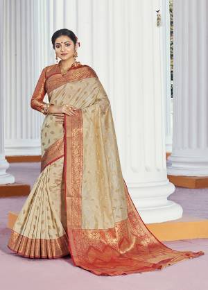 Classy Saree look pretty like never before.Wearing this Cream Color Saree which made from Handloom Silk With Orange Color Handloom Silk blouse, Saree has also decorative work like Heavy Zari Work With Woven.This beautiful Saree features a classy Zari Work Work all over,which makes it a smart pick for all occasions And You can wear this Saree in different styles. Buy Now.