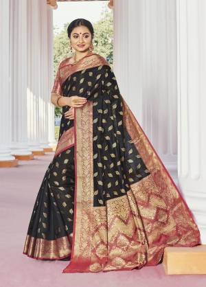 Classy Saree look pretty like never before.Wearing this Black Color Saree which made from Handloom Silk With Orange Color Handloom Silk blouse, Saree has also decorative work like Heavy Zari Work With Woven.This beautiful Saree features a classy Zari Work