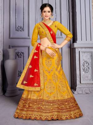 Catch All The Limelight At The Next Wedding You Attend Wearing This Heavy Designer Lehenga Choli In Musturd Yellow Color Paired with Contrasting Red Color Dupatta. Its Blouse Is Silk Based Paired With Satin Silk Lehenga And Net Fabricated Dupatta. Buy Now.