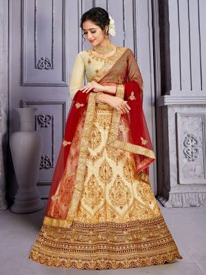Catch All The Limelight At The Next Wedding You Attend Wearing This Heavy Designer Lehenga Choli In Cream Color Paired with Contrasting Maroon Color Dupatta. Its Blouse Is Silk Based Paired With Satin Silk Lehenga And Net Fabricated Dupatta. Buy Now.