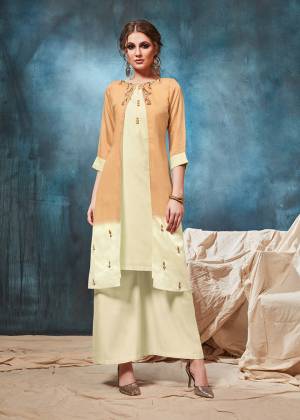 Grab This Designer Readymade Indo-Western Pair In Cream And Light Orange Color Consisting Of A Blouse, Skirt And A Jacket. This Pretty Pair Is Viscosed Based Beautified With hand Work. Buy Now.