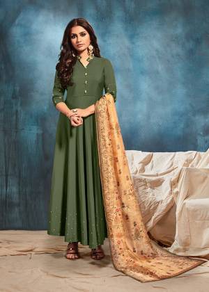 You Will Definitely Earn Lots Of Compliments Wearing This Designer Readymade Floor Length Gown In Dark Green Color Paired Beige Colored Digital Printed Dupatta. Its Rich Color Combination And Minimal Embroidery Gives An Elegant Look To Your Personality. 