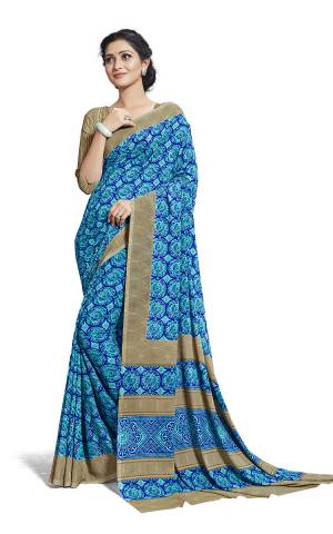 Comfort Is The First Priority When You Go To Your Work Place. So Keeping Your Comfort In Mind This Printed Saree Is Designed As A Uniform For Your Work Place. This Saree And Blouse are Fabricated On Georgette Beautified With Prints Which Is Also Light In Weight And Easy To Carry All Day Long