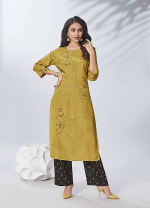 Celebrate This Festive Season With Beauty And Comfort Wearing This Designer Readymade Kurti In Musturd Yellow Color Paired With Black Colored Bottom. This Hand Embroidered kurti Is Fabricated on Viscose Rayon Paired With Cotton Bottom. 
