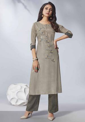 Flaunt Your Rich And Elegant Taste Wearing This Designer Readymade Kurti In Grey Color Paired With Dark Grey Colored Bottom. This Kurti Is Fabricated on Viscose Rayon Beautified With Hand Work Paired With Cotton Fabricated Bottom. Buy Now.
