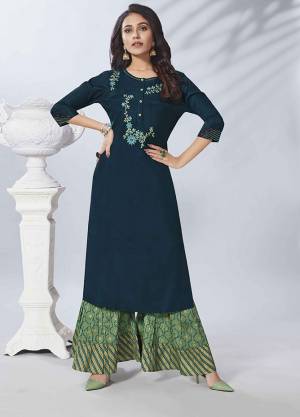 Here Is A Very Pretty Readymade Pair Of Kurti And Bottom In Navy Blue And Green Color Respectively. This Pretty Kurti Is Fabricated On Viscose Rayon Paired With Cotton Fabricated Bottom. Buy Now.
