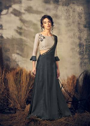 New And Unique Patterned Designer Readymade Indo-Western Dress IS Here In Beige Colored Blouse Paired With An Over Dress In Dark Grey Color. This Designer piece Is Fabricated on Viscose And Satin Silk Beautified With Hand work. 