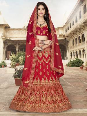 Here Is A Very Pretty Heavy Designer Lehnega Choli In All Over Red Color. Its Embroidered Blouse Is Fabricated On Art Silk Paired With Satin Silk Fabricated Lehenga And Net Fabricated Dupatta. All Its Fabrics Enusres Superb Comfort Throughout The Gala.