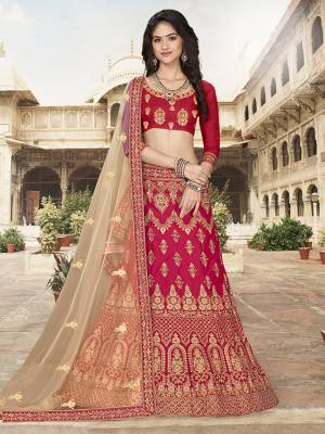 Grab This Heavy Designer Lehenga Choli In Dark Pink Color Paired With?Contrasting Cream Colored Dupatta. Its Blouse Is Fabricated On Art Silk Paired With Satin Silk Fabricated Lehenga And Net Dupatta. Its Pretty Blouse And Lehenga Are Beautified With Embroidery Which Comes With A Net Dupatta With Lace Border. Buy Now