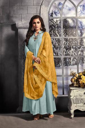 Look Pretty In This Designer Readymade Long Dress In Sky Blue Color Paired With Contrasting Yellow Colored Dupatta. The Hand Embroidered Top Is Fabricated on Muslin Paired With Net Fabricated Heavy Embroidered Dupatta. 