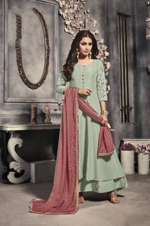 Celebrate This Festive Season With Beauty And Comfort Wearing This Designer Readymade Long Suit In Pastel Green Color Paired With Contrasting Dusty Pink Colored Dupatta. This Top Is Fabricated on Linen Silk Paired With Viscose Fabricated Dupatta. 