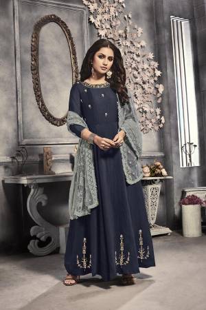 Enhance Your Personality Wearing This Designer Readymade Long Suit In Navy Blue Color Paired With Grey Colored Dupatta. Its Pretty Embroidered Top Is Viscose Based Paired With Net Fabricated Heavy Embroidered Dupatta. Buy Now.