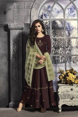 Add This Beautiful Designer Readymade Long Suit To Your Wardrobe In Dark Brown Colored Top Paired With Light Green Colored Heavy Embroidered Dupatta. This Top Is Fabricated On Satin Paired With Net Fabricated Dupatta. 
