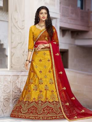For A Proper Traditional Look, Grab This Heavy Designer Lehenga Choli In Yellow Color Paired With Contrasting Red Colored Blouse. Its Blouse Is Fabricated On Art Silk Paired With Satin Silk Lehenga And Net Fabricated Dupatta. It Is Beautified With Attractive Embroidery. Buy This Pretty Piece Now.