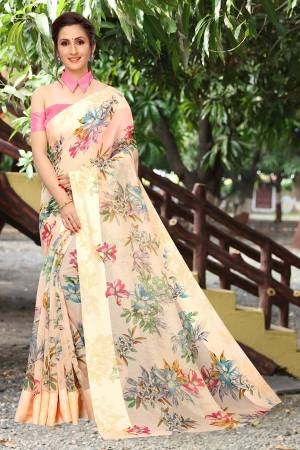 Simple And Elegant Looking Designer Saree In Here In Peach Color Paired With Pink Colored Blouse. This Saree And Blouse Are Fabricated On Linen Cotton Beautified With Floral Prints All Over. Its Soft Rich Fabric And Elegant Color Will Give A Rich look To Your Personality. 