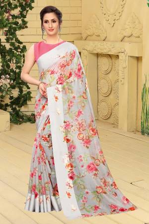 Look Pretty In This Floral Printed Lovely Saree In Pale Grey Color Paired With Old Rose Pink Colored Blouse. This Saree And Blouse Are Fabricated on Linen Cotton. Its Rich Fabric And Elegant Color Will Earn You Lots of Compliments From Onlookers. 