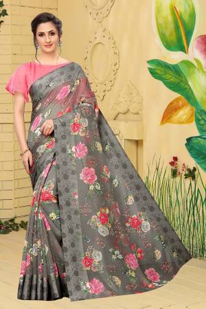 Here Is A Very Pretty And Elegant Looking Designer Saree In Dark Grey Color Paired With Pink Colored Blouse. This Saree And Blouse Are Linen Cotton Based Beautified With Pretty Floral Prints. It Is Light Weight, Durable And Easy To Carry All Day Long. 