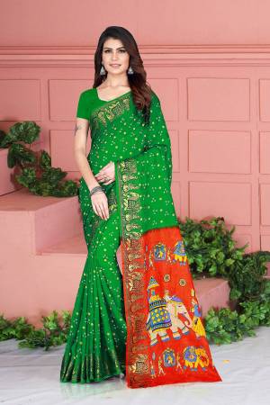For A Proper Traditional Look, Grab This Designer Silk Based Saree In Green Color. This Saree And Blouse Are Fabricated On Art Silk Beautified With Weave And Prints. Its Fabric Is Durable, Light Weight And Easy To Carry All Day Long. 