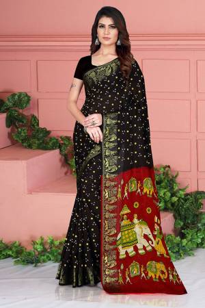 For A Proper Traditional Look, Grab This Designer Silk Based Saree In Black Color. This Saree And Blouse Are Fabricated On Art Silk Beautified With Weave And Prints. Its Fabric Is Durable, Light Weight And Easy To Carry All Day Long. 