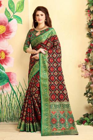 Here Is A Prefectly Suitable Designer Silk Based Saree For The Upcoming Festive And Wedding Season. This Pretty Saree In Wine Color Paired With Green Colored Blouse. This Saree And Blouse Are Fabricated Patola Jacquard Silk Beautified Attractive Detailed Weave All over. Buy This Rich Designer Saree Now.