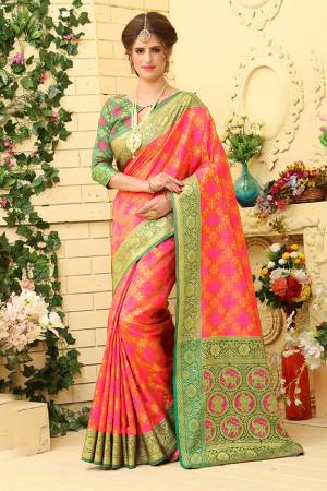 Grab This Attractive Looking Heavy Weaved Designer Saree In Pink Color Paired With Green Colored Blouse. This Saree And Blouse Are Fabricated Patola Jacquard Silk  Beautified With Weave All over. 