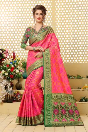 Grab This Attractive Looking Heavy Weaved Designer Saree In Pink Color Paired With Green Colored Blouse. This Saree And Blouse Are Fabricated Patola Jacquard Silk  Beautified With Weave All over. 