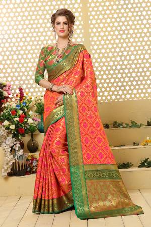 Here Is A Prefectly Suitable Designer Silk Based Saree For The Upcoming Festive And Wedding Season. This Pretty Saree In Golden & Pink Color Paired With Green Colored Blouse. This Saree And Blouse Are Fabricated Patola Jacquard Silk Beautified Attractive Detailed Weave All over. Buy This Rich Designer Saree Now.