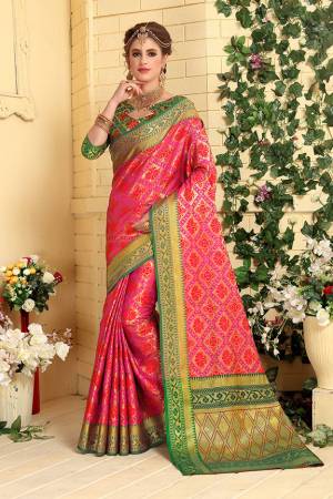 Here Is A Prefectly Suitable Designer Silk Based Saree For The Upcoming Festive And Wedding Season. This Pretty Saree In Pink Color Paired With Green Colored Blouse. This Saree And Blouse Are Fabricated Patola Jacquard Silk Beautified Attractive Detailed Weave All over. Buy This Rich Designer Saree Now.