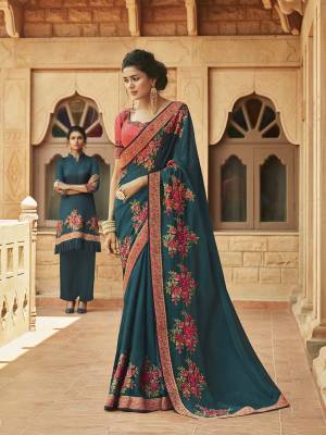 Here Is A Beautiful And Attractive Looking Heavy Designer Saree In Teal Blue Color Paired With Contrasting Old Rose Pink Colored Blouse. This Saree Is Fabricated On Satin Georgette Paired With Art Silk Fabricated Blouse. It Is Beautified With Contrasting Attractive Embroidery. Buy Now.