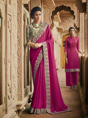 Bright And Visually Appealing Heavy Designer Saree Is Here In Dark Pink Color Paired With Contrasting Pastel Green Colored Blouse. This Saree Is Fabricated On Slub Silk Paired With Art Silk Fabricated Blouse. It Has Heavy Embroidered Blouse With Heavy Embroidered Saree Border. 