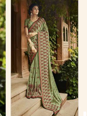 Get Ready For The Upcoming Wedding And Festive Season Wearing This Heavy Designer Saree In Light Green Color. This Saree Is Fabricated On Crush Art Silk Paired With Art Silk Fabricated Blouse. Buy This Saree Now.