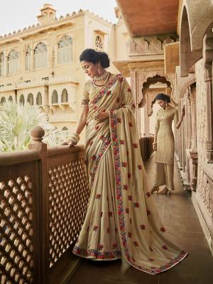 Flaunt Your Rich And Elegant Taste Wearing This Designer Saree In Beige Color Paired With Beige Colored Blouse. This Saree Is Fabricated On Soft Art Silk Paired With Art Silk Fabricated Blouse. Buy Now.