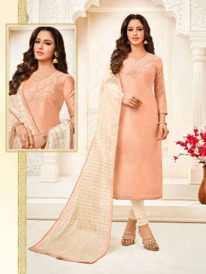 Flaunt Your Rich And Elegant Taste Wearing This Designer Pretty Suit In Light Peach Colored Top Paired With Cream Colored Bottom And Dupatta. Its Top Is Fabricated  On Modal Paired With Cotton Bottom And Chanderi Fabricated Dupatta. Buy Now.