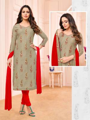 Simple And Elegant Straight Suit Is Here For Your Semi-Casual Wear In Grey Colored Top Paired With Contrasting Red Colored Bottom And Dupatta. Its Top Is Modal Based Paired With Cotton Bottom And Chiffon Fabricated Dupatta. 