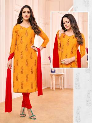 Simple And Elegant Straight Suit Is Here For Your Semi-Casual Wear In Orange Colored Top Paired With Contrasting Red Colored Bottom And Dupatta. Its Top Is Modal Based Paired With Cotton Bottom And Chiffon Fabricated Dupatta. 