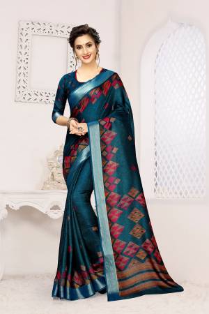 New Shade Is Here To Add Into Your Wardrobe With This Designer Saree In Teal Blue Color. This Saree And Blouse Are Fabricated On Linen Beautified With Prints. 