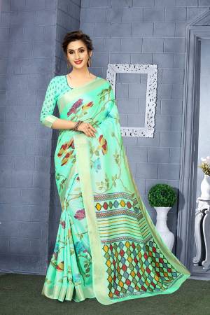 Celebrate This Festive Season With Beauty And Comfort In This Very Pretty Designer Printed Saree In sea Green Color. This Saree And Blouse Are Fabricated On Linen Which Is Light Weight, Durable And Easy To Carry All Day Long. 