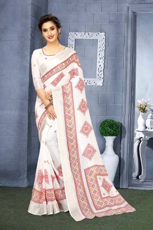 Flaunt Your Rich And Elegant Taste Wearing This Pretty Saree In White Color. This Rich Saree And Blouse Are Fabricated On Linen Beautified With Prints. 