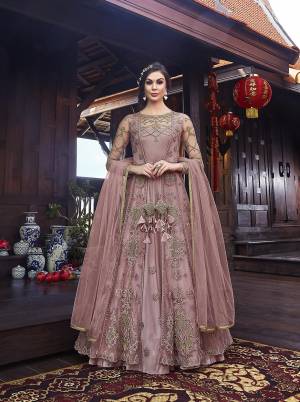 Look Pretty In This Designer Indo Western Dress In All Over Onion Pink Color. Its Gown IS Fabricated On Satin Paired With Embroidered Net Fabricated Jacket With Santoon Bottom And Net Dupatta. 