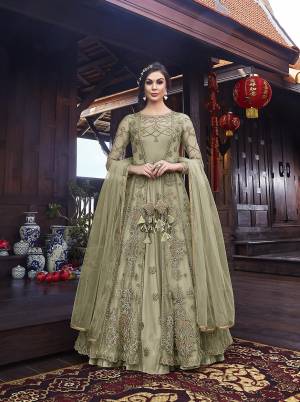 Look Pretty In This Designer Indo Western Dress In All Over Pastel Green Color. Its Gown IS Fabricated On Satin Paired With Embroidered Net Fabricated Jacket With Santoon Bottom And Net Dupatta. 