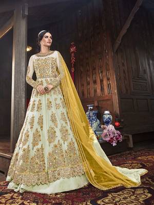 Get Ready Fot The Upcoming Festive And Wedding Season With This Designer Indo Western Suit With Two Bottom,In Light Pastel Green Color Paired With Contrasting Yellow Colored Dupatta. Its Heavy Embroidered Top Is Fabricated On Net Paired With Art Silk Lehenga And Net Dupatta. Also It Comes With A Very Pretty Embroiderd Art Silk Fabricated Pant. 