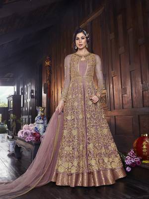 Flaunt Your Rich And Elegant Taste In This Lovely Designer Indo-Western Suit In Onion Pink Color. It Has Elegant Looking Floor Length Gown Fabricated on Art Silk With Embroidered Net Fabricated Jacket Paired With Art Silk Fabricated bottom And Net Dupatta. 