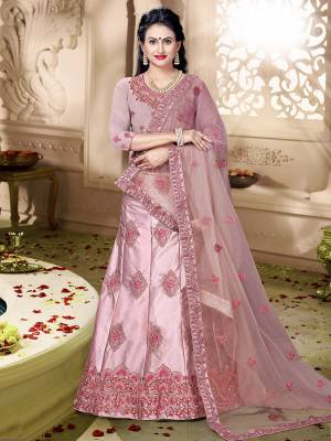 Flaunt Your Rich And Elegant Taste Wearing This Designer Lehenga Choli In All Over Pink Color. Its Blouse Is Fabricated On Art Silk Paired With Satin Silk Fabricated Lehenga And Net Fabricated Dupatta. It Is Beautified With Pretty Tone To Tone Embroidery. 