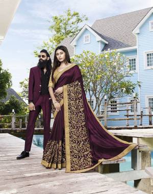 You Will Definitely Earn Lots Of Compliments Wearing This Heavy Designer Saree In Wine Color Paired With Beige Colored Blouse. This Pretty Heavy Embroidered Saree Is Silk Based Paired With Jacquard Silk Fabricated Blouse. 