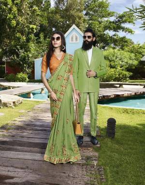 Celebrate This Festive And Wedding Season Wearing This Beautiful Heavy Designer Saree In Light Green Color Paired With Orange Colored Blouse. This Saree Is Fabricated On Art Silk Paired With Jacquard Silk Fabricated Blouse. Buy Now. 