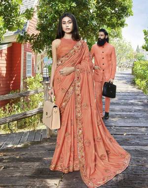 Shine Bright Wearing This Attractive Looking Heavy Designer Saree In Dark Peach Color Paired With Dark Peach Colored Blouse. This Saree Is Fabricated on Art Silk Beautified With Embroidery Paired With Jacquard Silk Fabricated Blouse. Buy This Designer Saree Now.