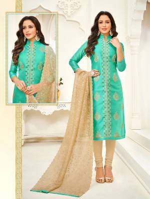 This Festive Season Have A Traditional Look Wearing This Designer Straight Suit In Sea Green Colored Top Paired With Beige Colored Bottom And Dupatta. Its Top Is Modal Based Paired With Cotton Bottom And Orgenza Fabricated Dupatta. It Is Beautified With Thread Work. 