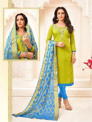 Add This Beautiful Designer Cotton Based Suit To Your Wardrobe In Parrot Green Colored Top Paired With Contrasting Blue Colored Bottom And Dupatta. Its Attractive Part Is Its Jacquard Silk Based Dupatta. Buy Now.