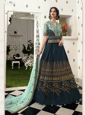 New And Unique Patterned Heavy Designer Lehenga Choli Is Here In Aqua Blue Colored Blouse Paired With Teal Blue Colored Lehenga And Aqua Blue Colored Dupatta. This Lehenga Choli Is Soft Silk Based Paired With Net Fabricated Dupatta. Buy Now.